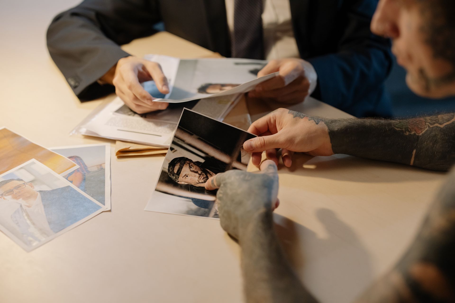 Legal investigator reviewing photographic case evidence