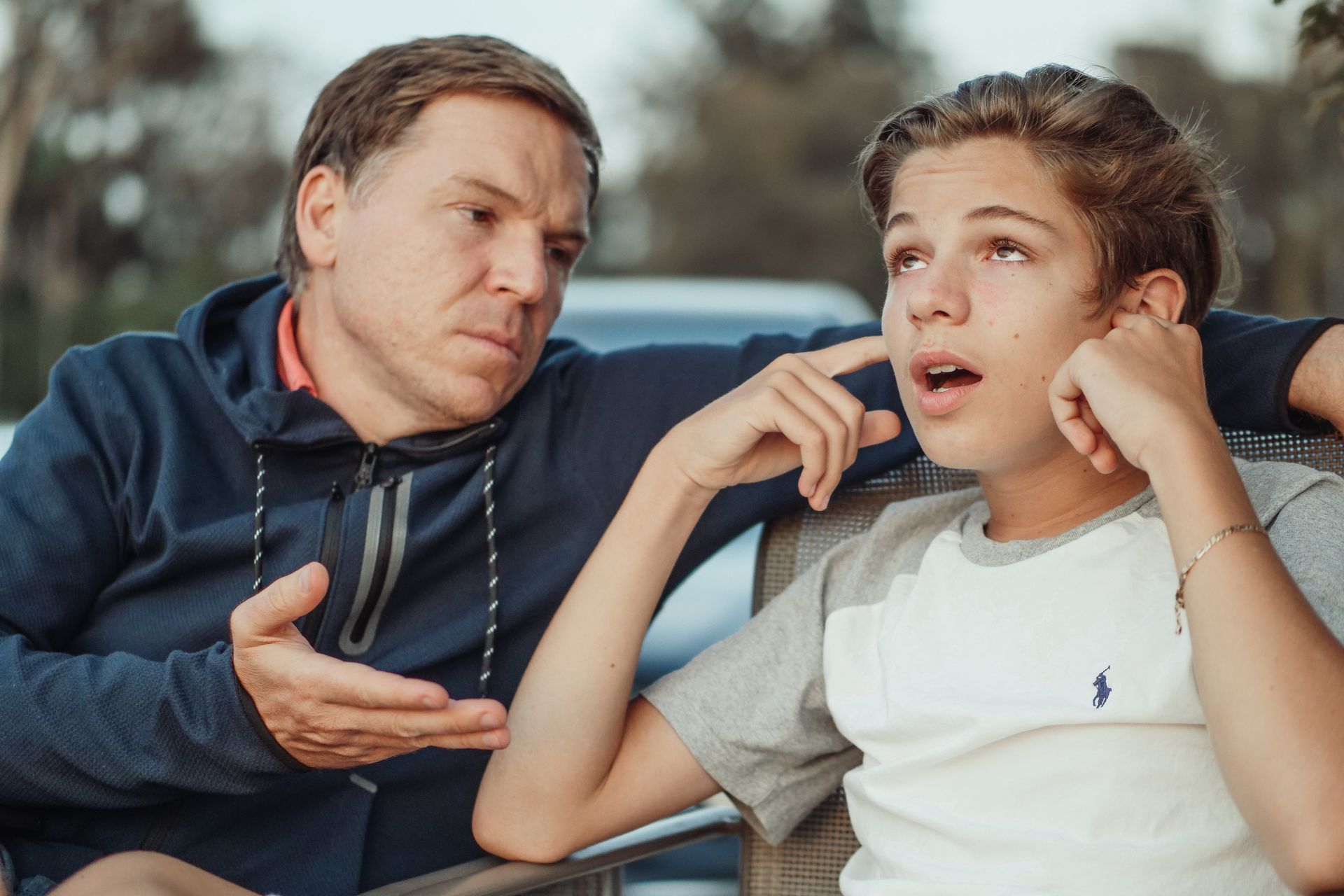 Father and teenage son having a serious conversation