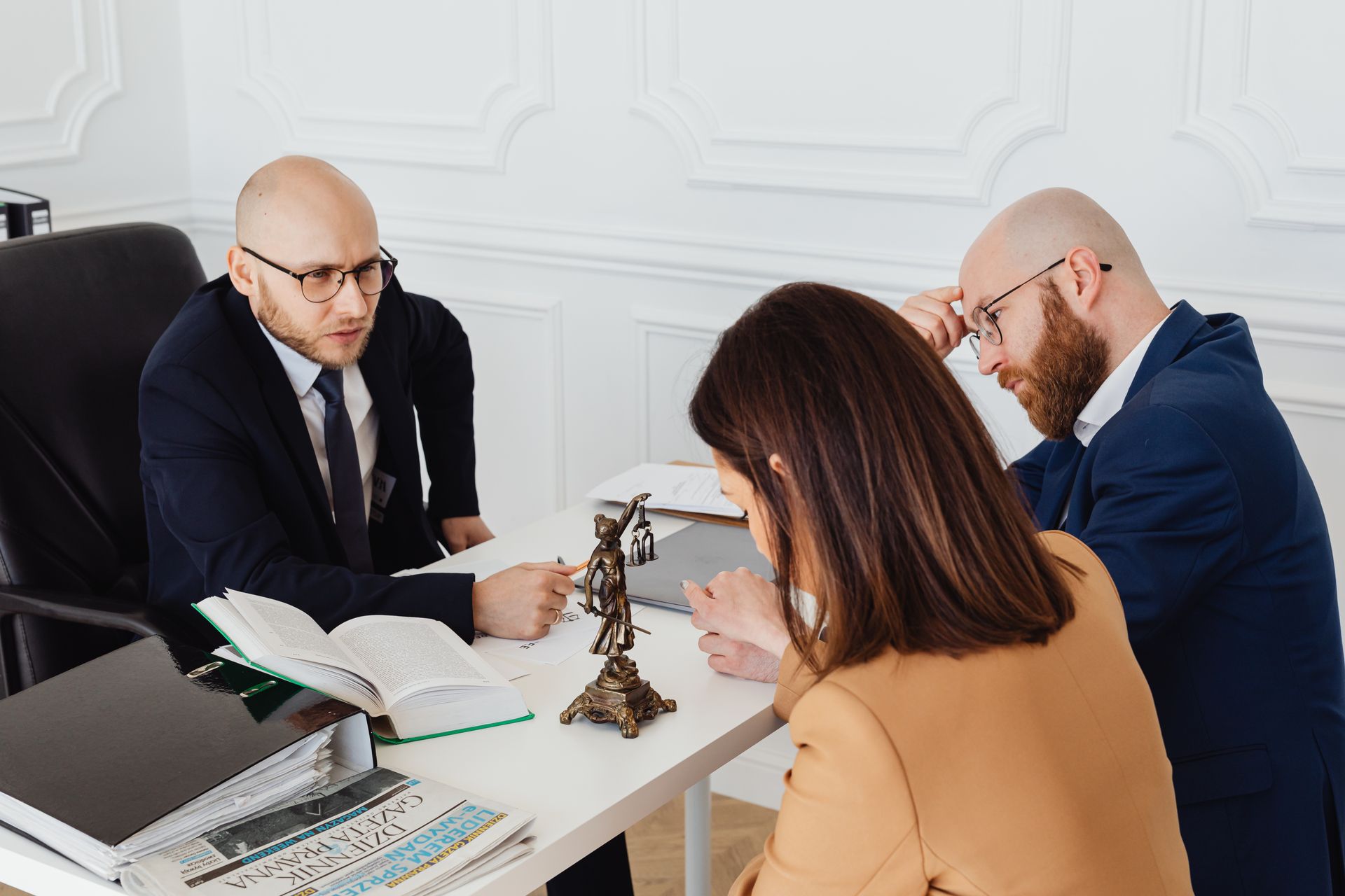 Attorney consulting with clients in an office