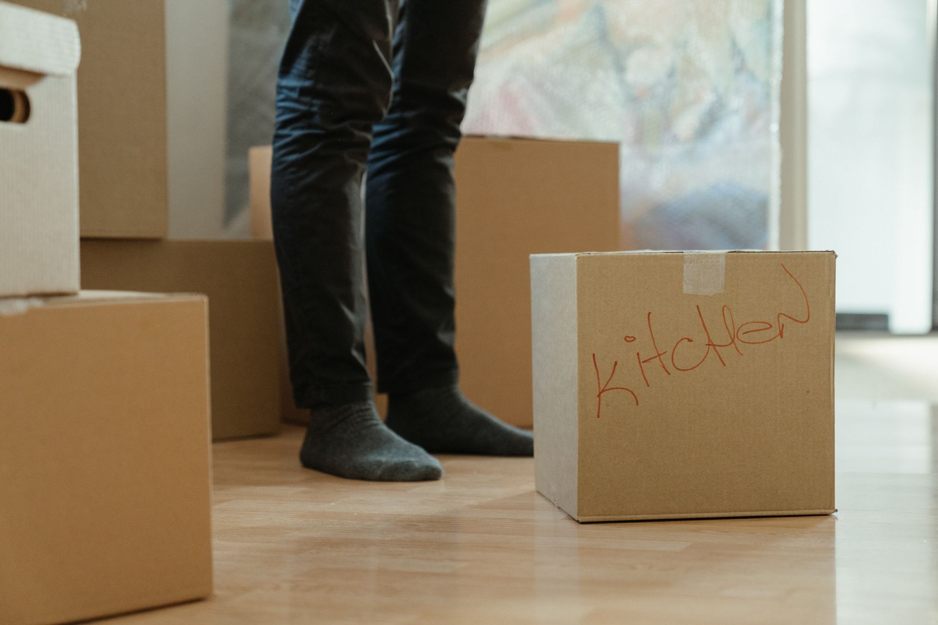 Moving boxes representing the transition to separate households