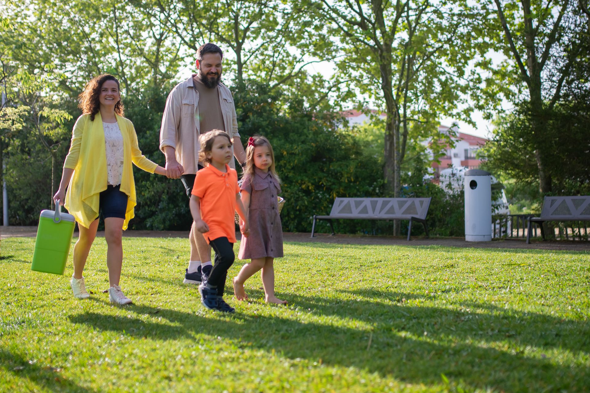 Family walking together through a park