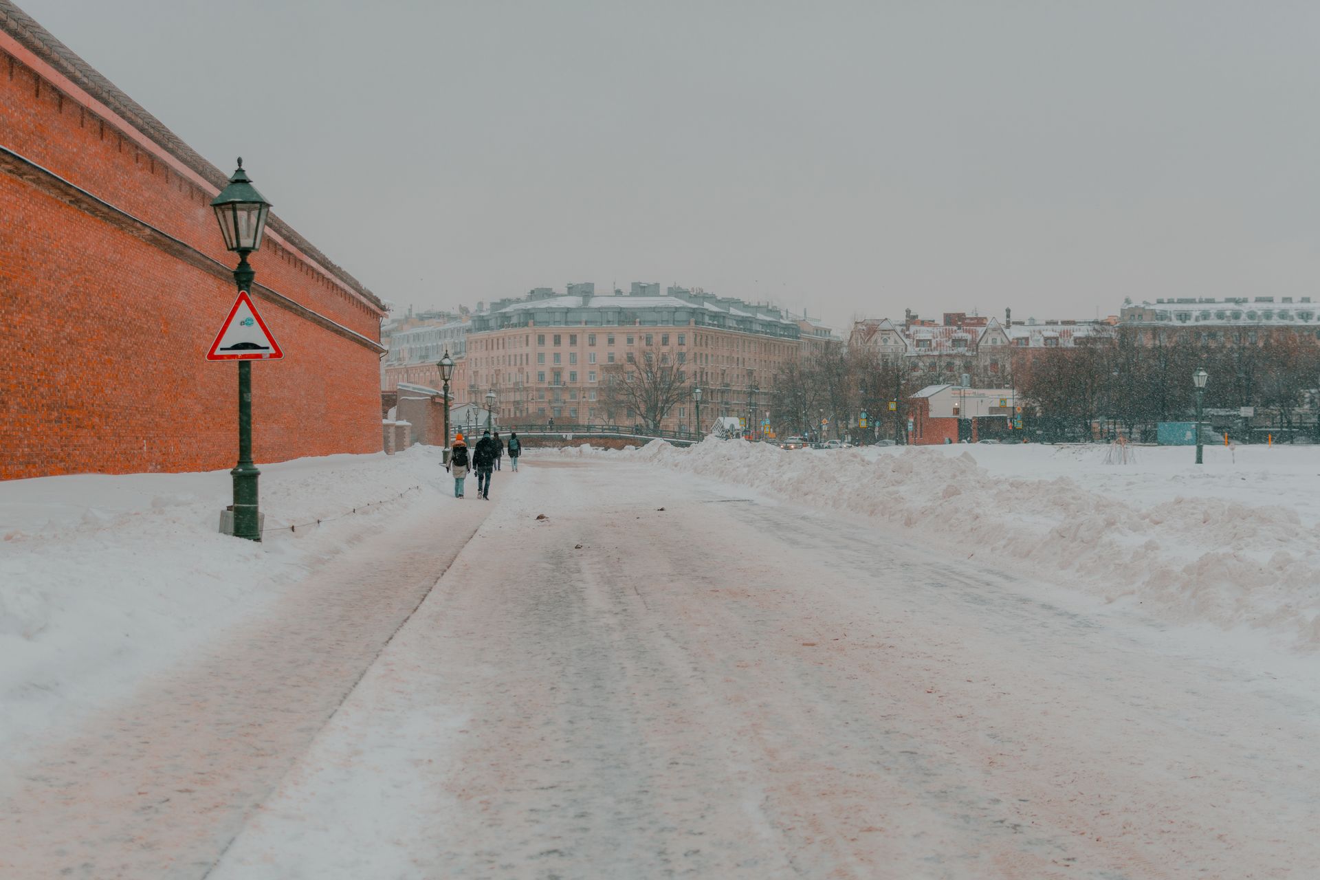 Snow-covered city walkway representing an icy fall hazard